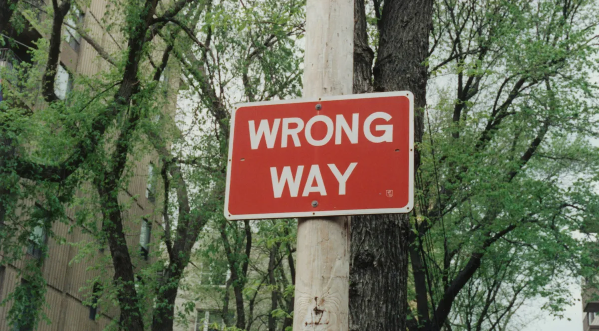 A wrong way road sign