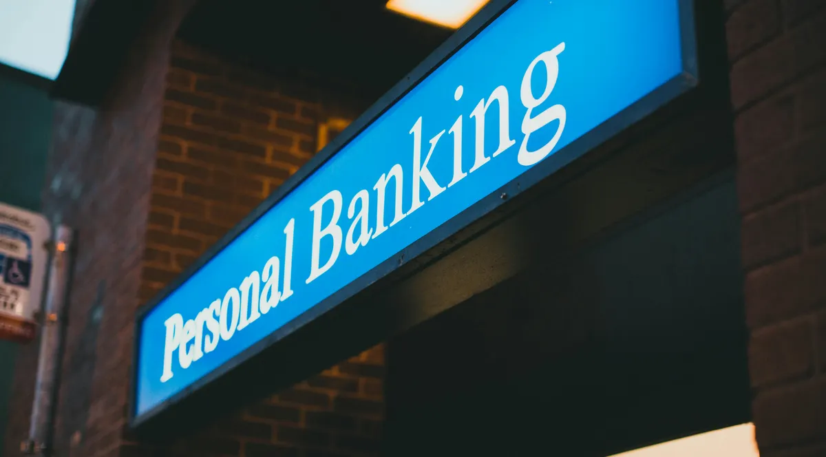 A personal banking sign on a bank branch