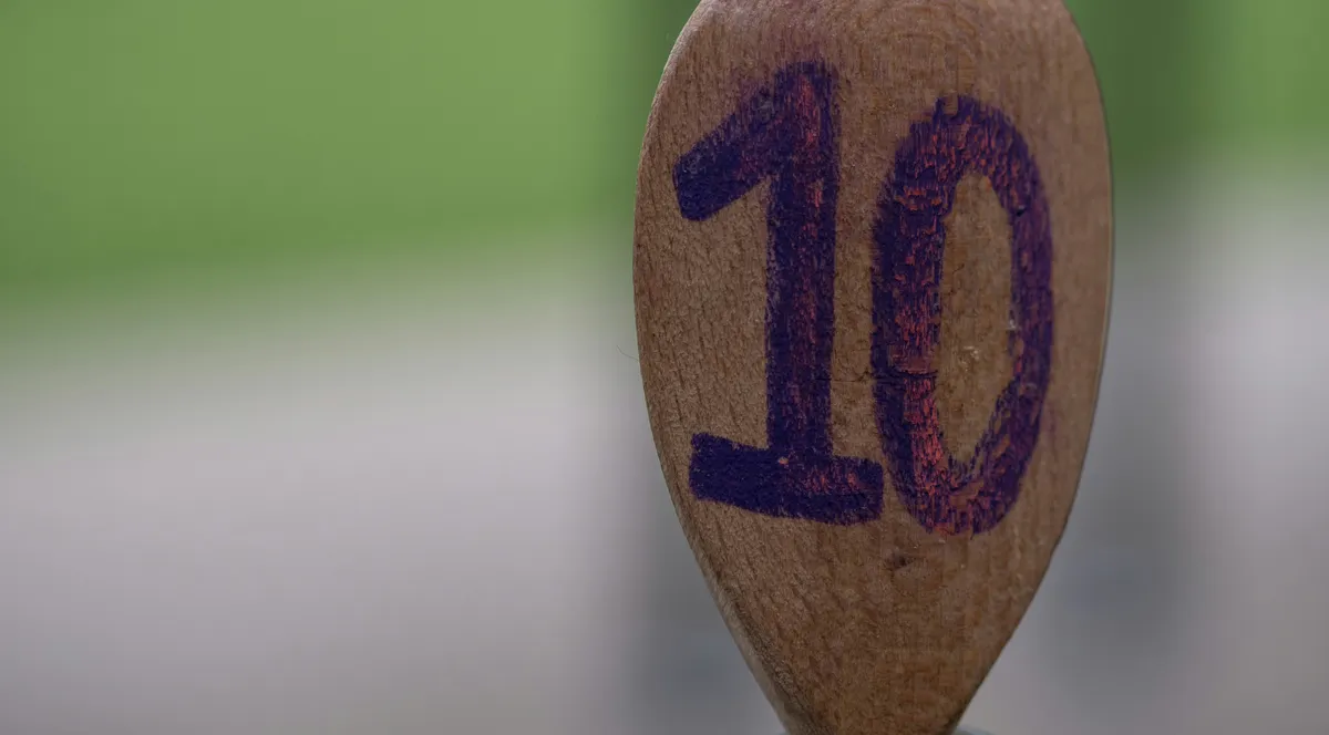 A wooden spoon marked with the number 10