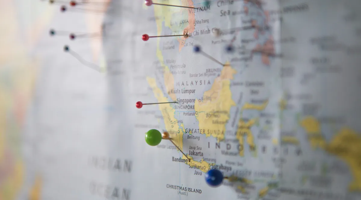 A world map with pins