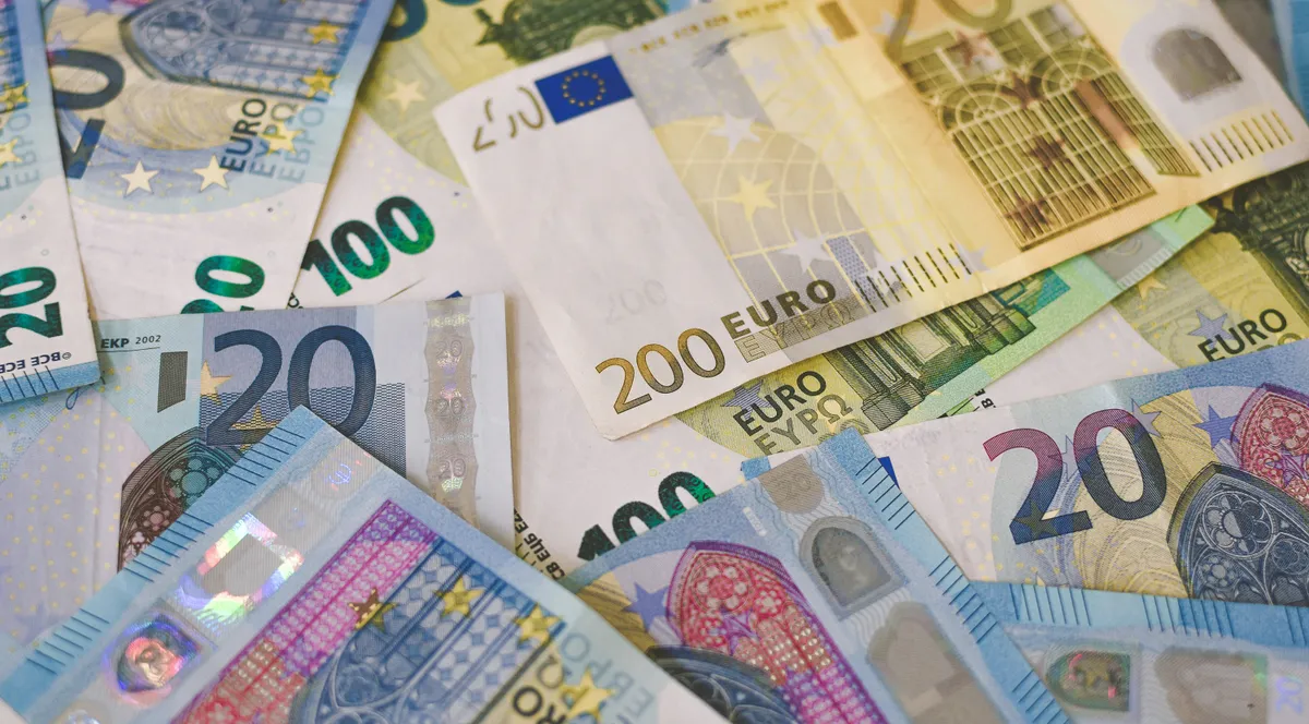 A 20 euro bill on a sheet of white paper